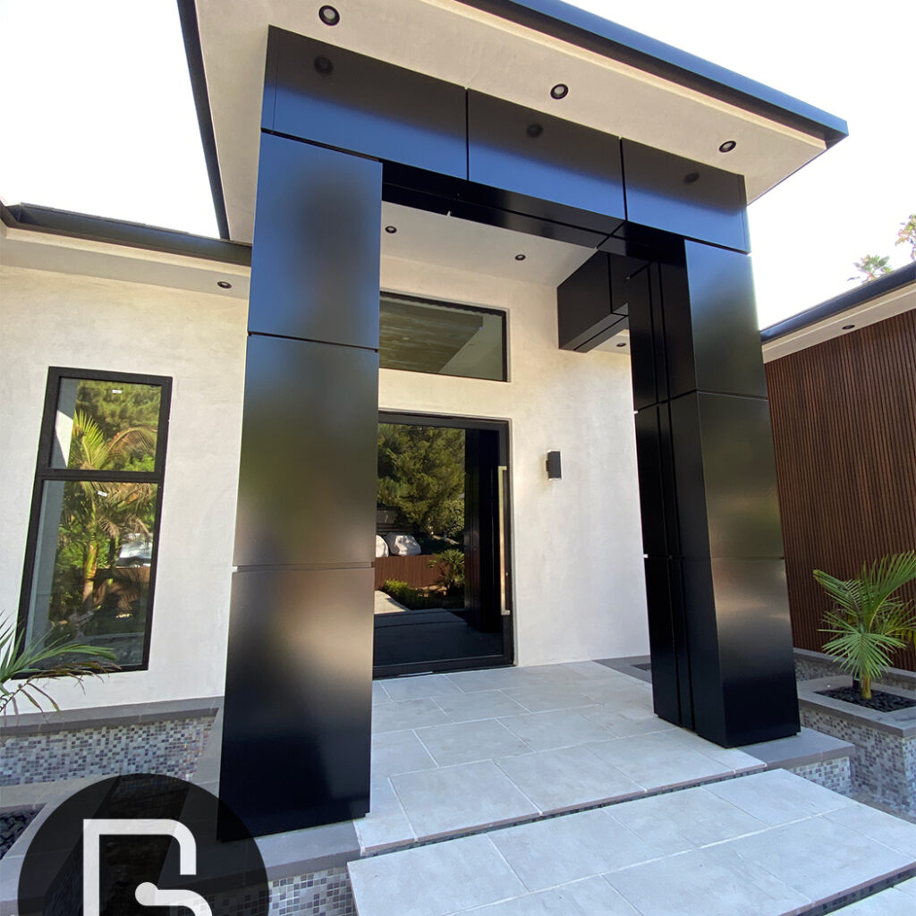 Black aluminum composite panels on entryway columns for a modern look.