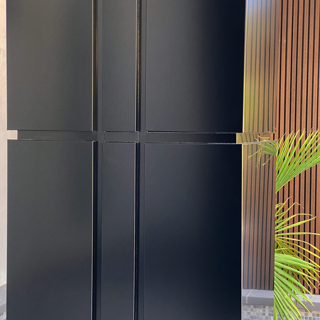 Black ACP column wraps on the exterior of a residential property.