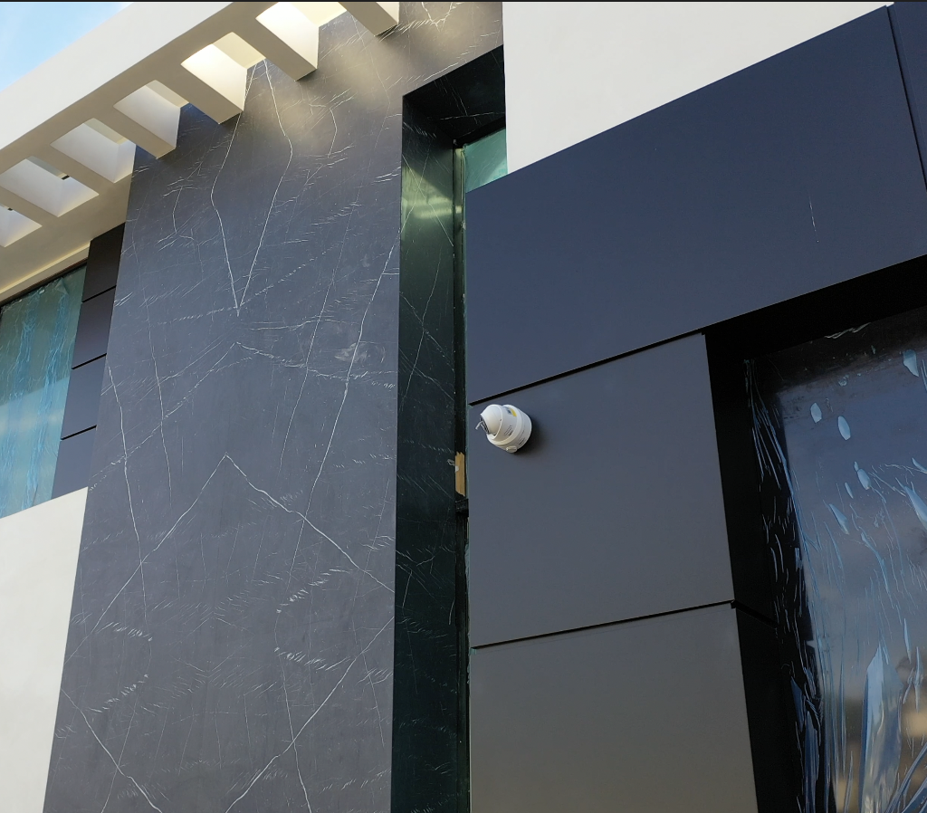 Black matte ACP facade cladding on modern residential exterior
