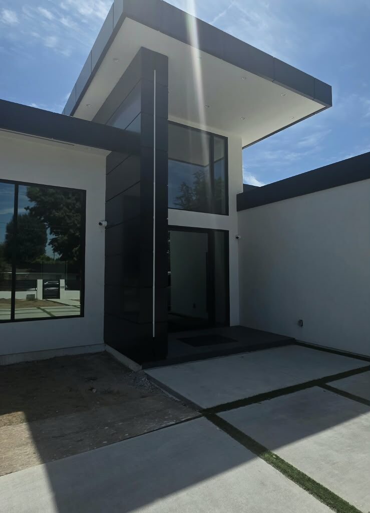 Black ACM column cladding on modern house facade in Los Angeles