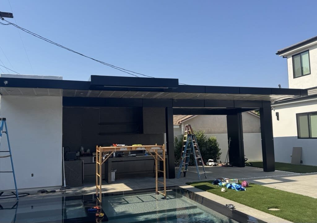 Black ACP canopy and ceiling cladding over outdoor kitchen