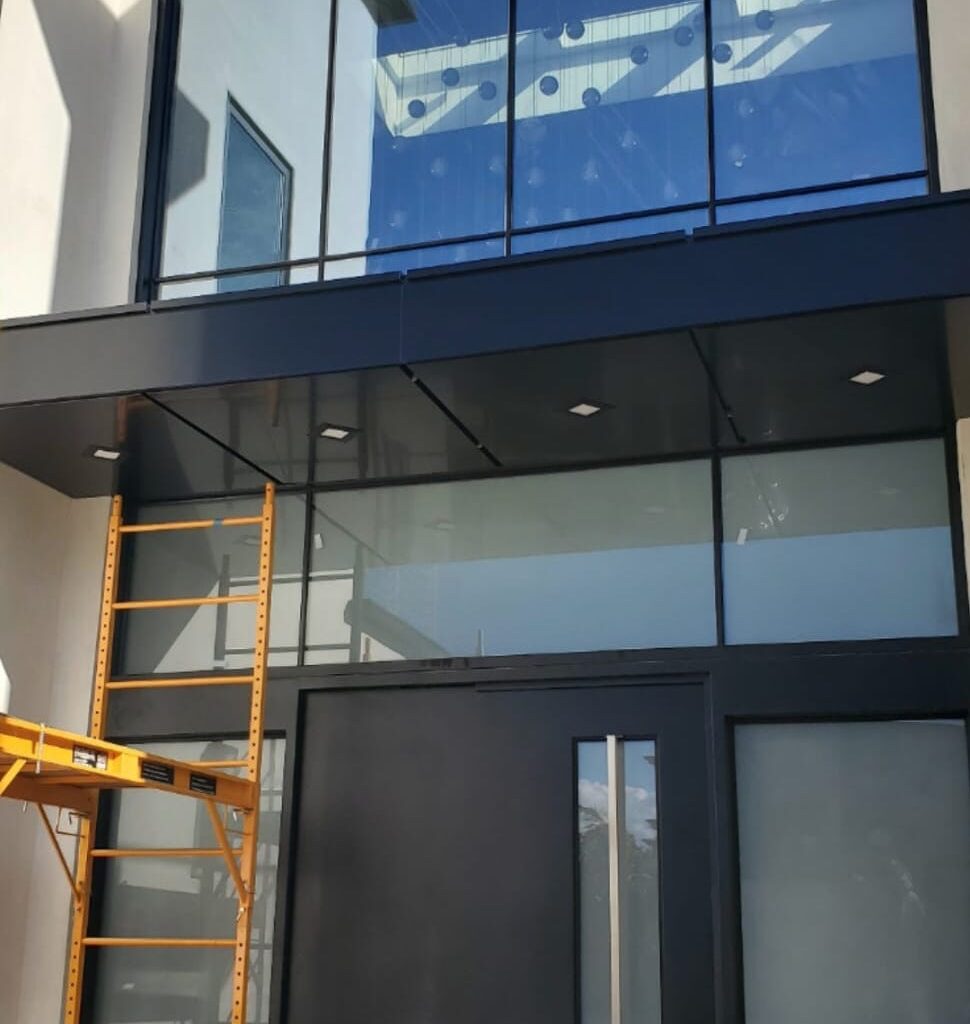 Black ACP entrance canopy with aluminum composite panel cladding in Los Angeles