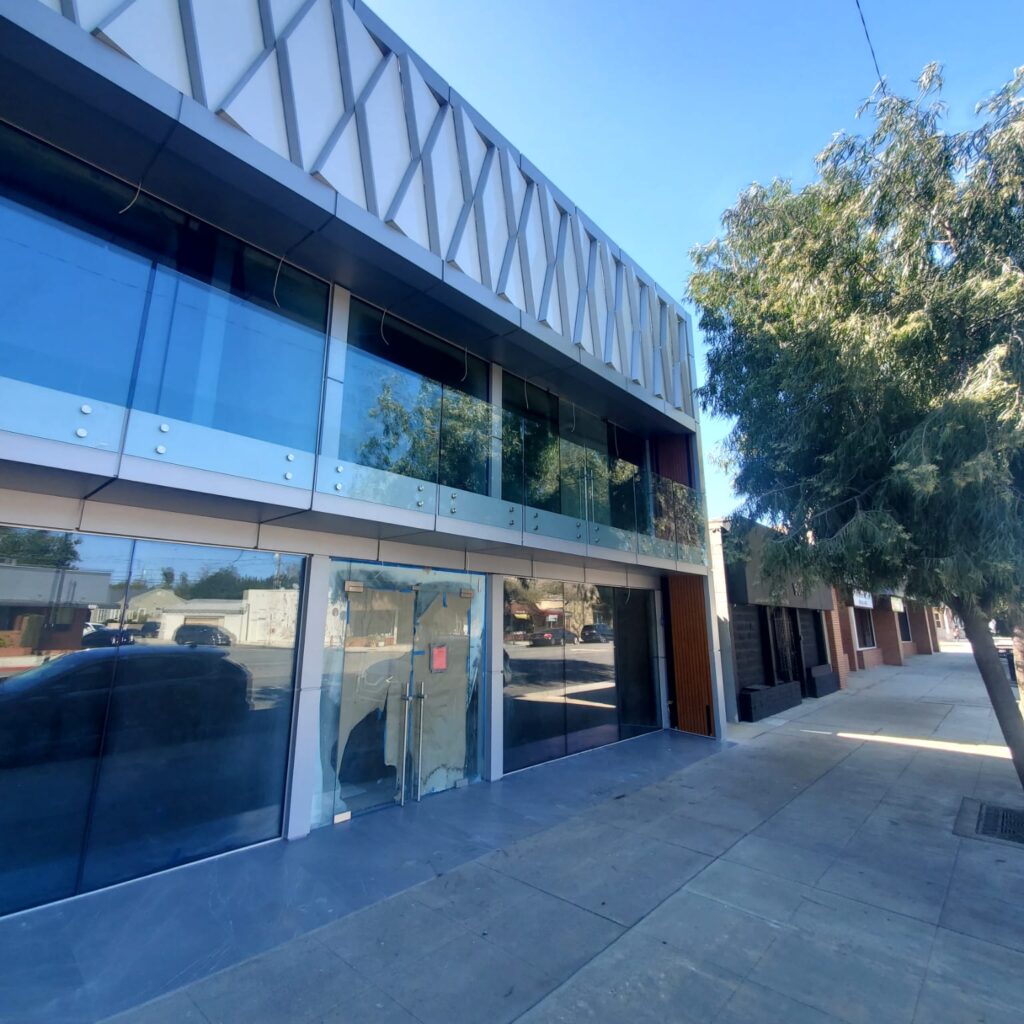 Commercial ACP facade with glass railings and aluminum composite panels